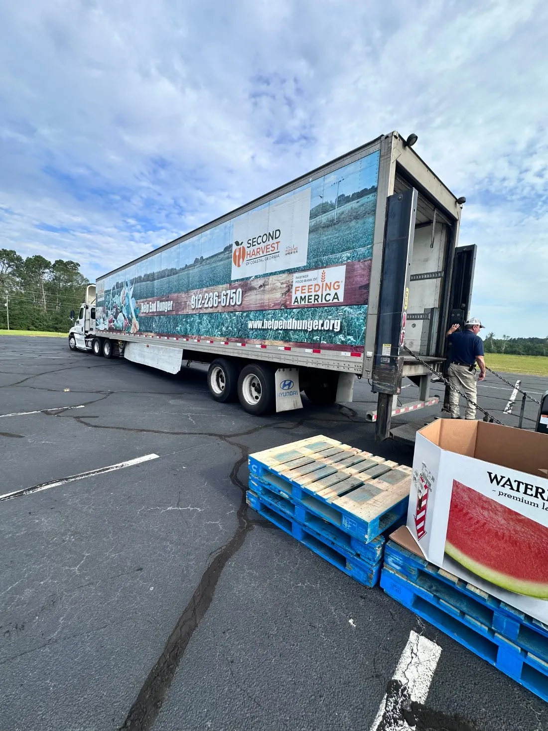 A Second Harvest food bank truck being unloaded